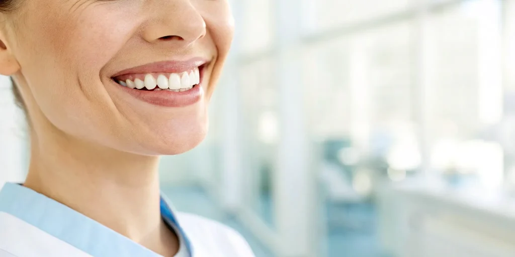Woman smiling after full mouth dental implants.