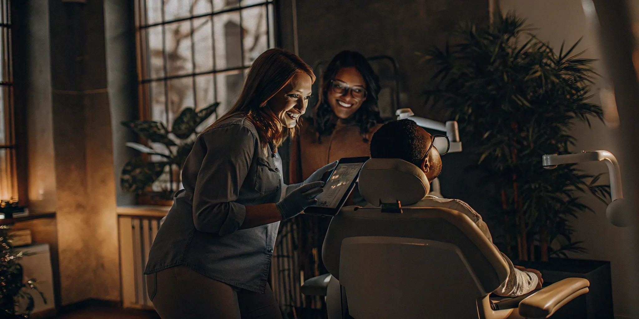 Virtual smile makeover consultation on a tablet.