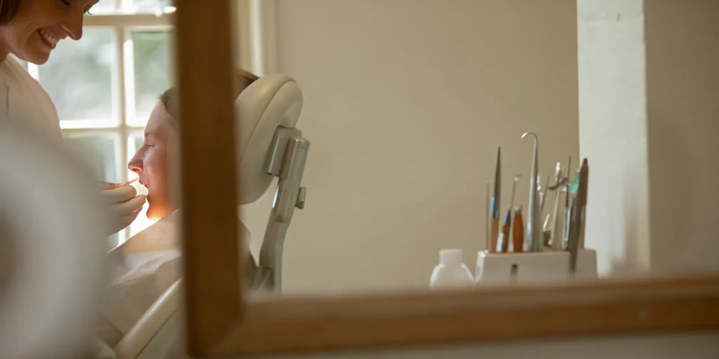 Woman smiling while learning about her smile makeover cost and options.
