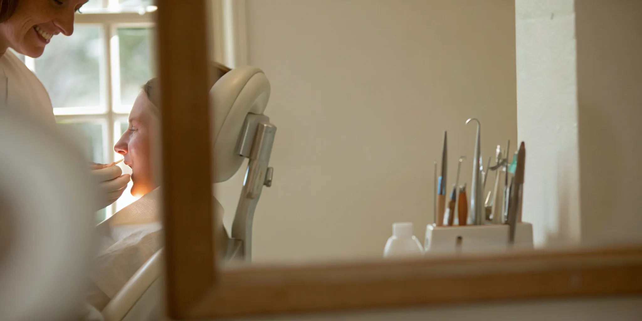 Woman smiling while learning about her smile makeover cost and options.